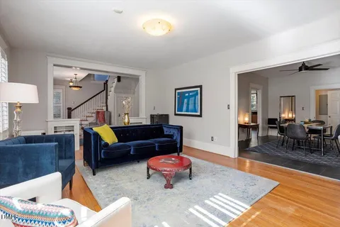 a bedroom with a bed a couch and a window