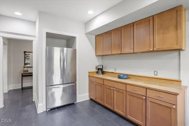 a kitchen with a sink and a refrigerator