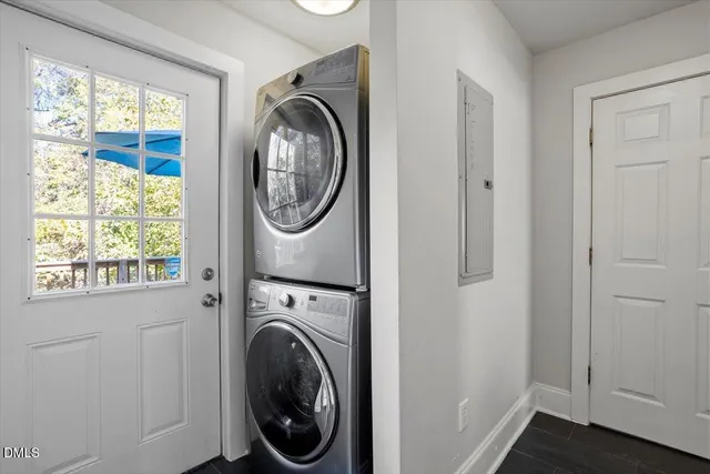 a view of a hallway with washer and dryer