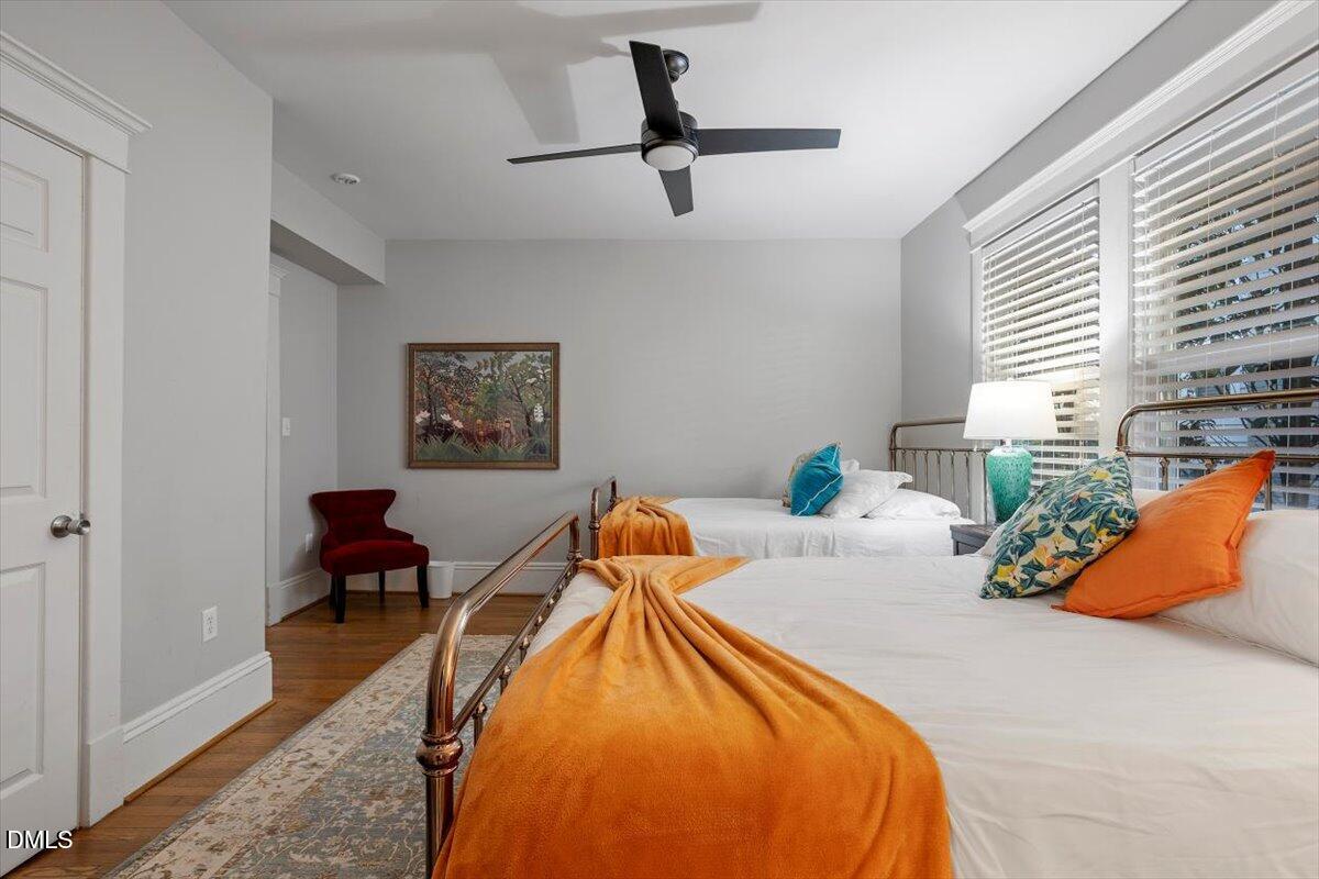 807 East Edenton Street Raleigh, NC 27601 - Photo 31 of 69 a bedroom with a bed a couch and a window