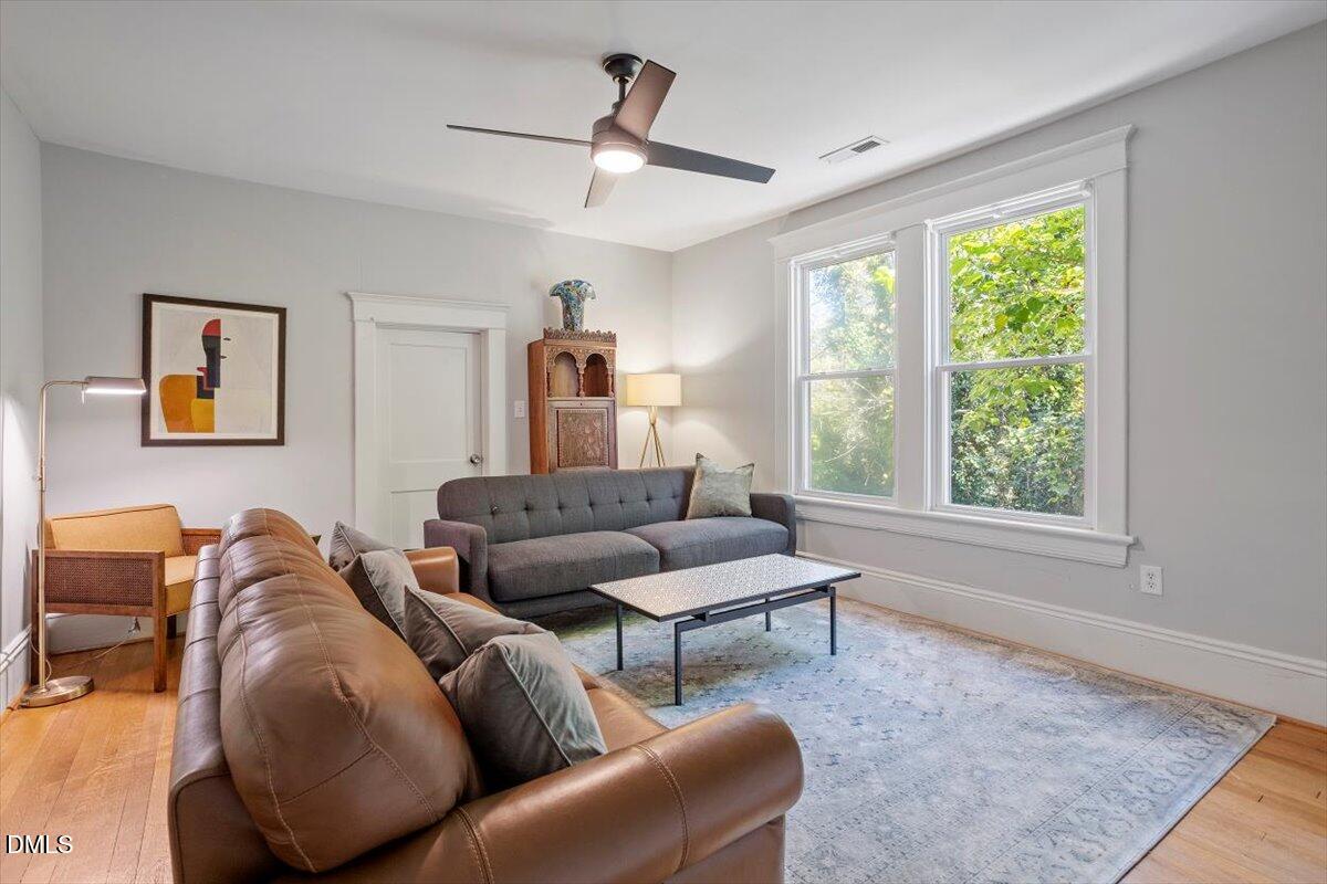 807 East Edenton Street Raleigh, NC 27601 - Photo 38 of 68 a living room with furniture and a large window