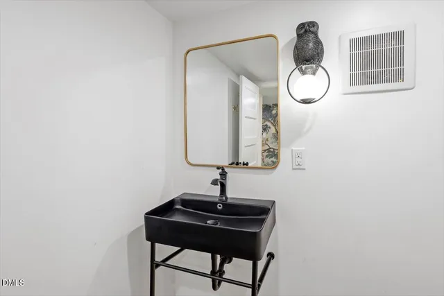 a kitchen with stainless steel appliances a sink and cabinets