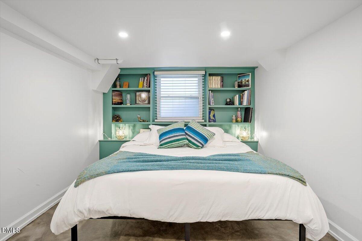 807 East Edenton Street Raleigh, NC 27601 - Photo 48 of 68 a bedroom with a bed and a window