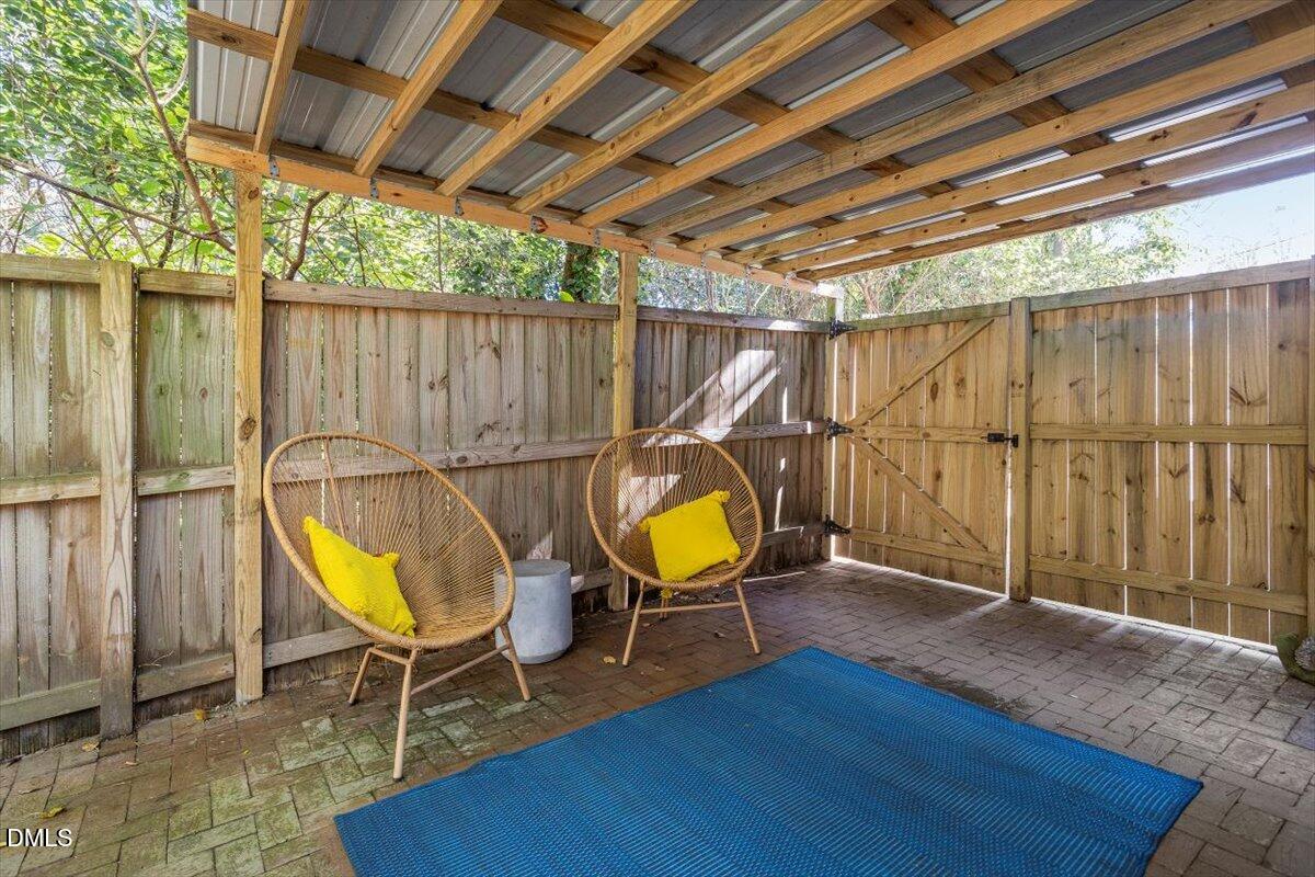 807 East Edenton Street Raleigh, NC 27601 - Photo 56 of 68 a view of a backyard with wooden floor and wooden fence