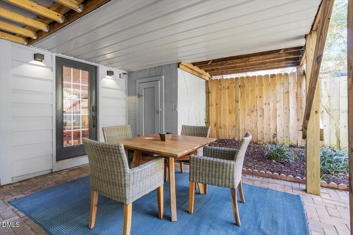 807 East Edenton Street Raleigh, NC 27601 - Photo 58 of 69 a view of a dining room with furniture and wooden floor