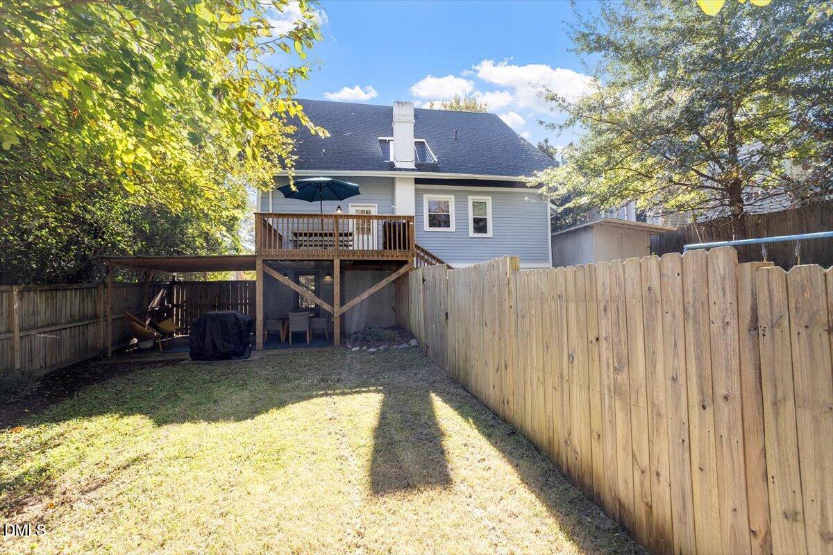 807 East Edenton Street Raleigh, NC 27601 - Photo 60 of 68 a view of a backyard with a small cabin