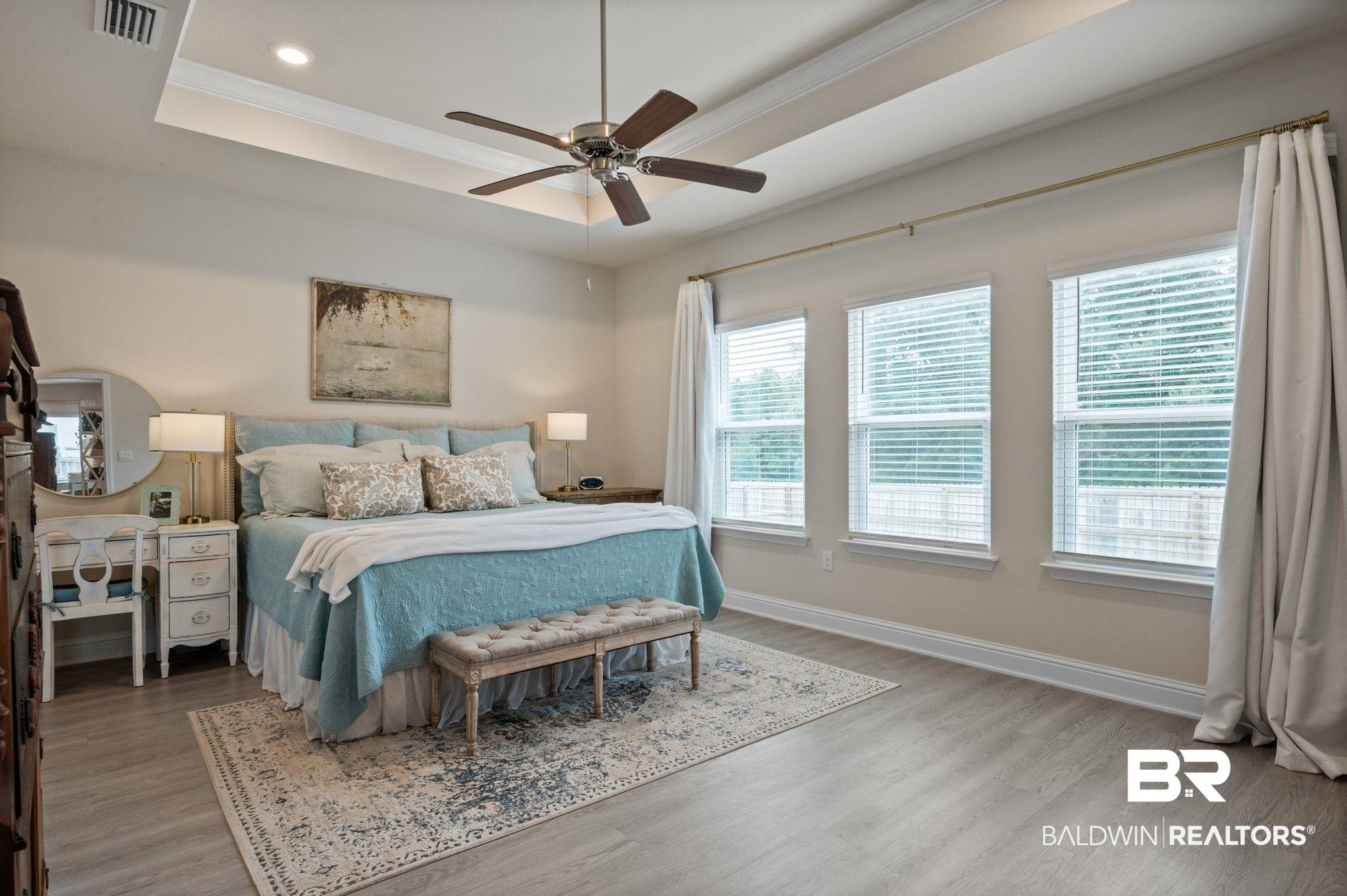 681 Calibre Street Fairhope, AL 36532 - Photo 29 of 56 Bedroom featuring hardwood / wood-style floors, ceiling fan, and a raised ceiling