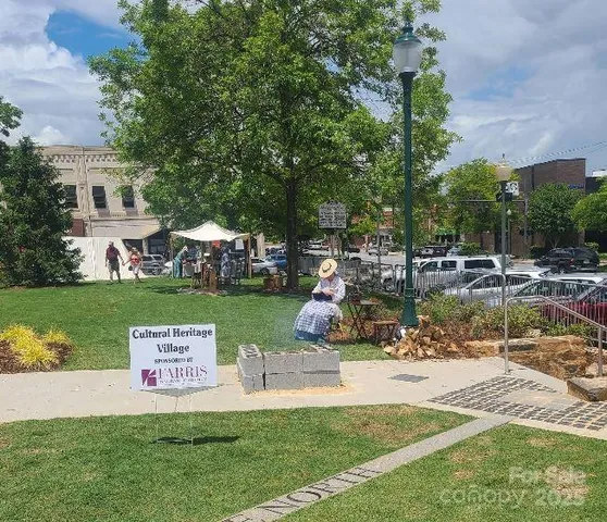 a terrace with outdoor seating and lake view