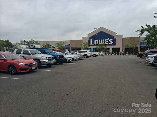 a view of a house with backyard and trees