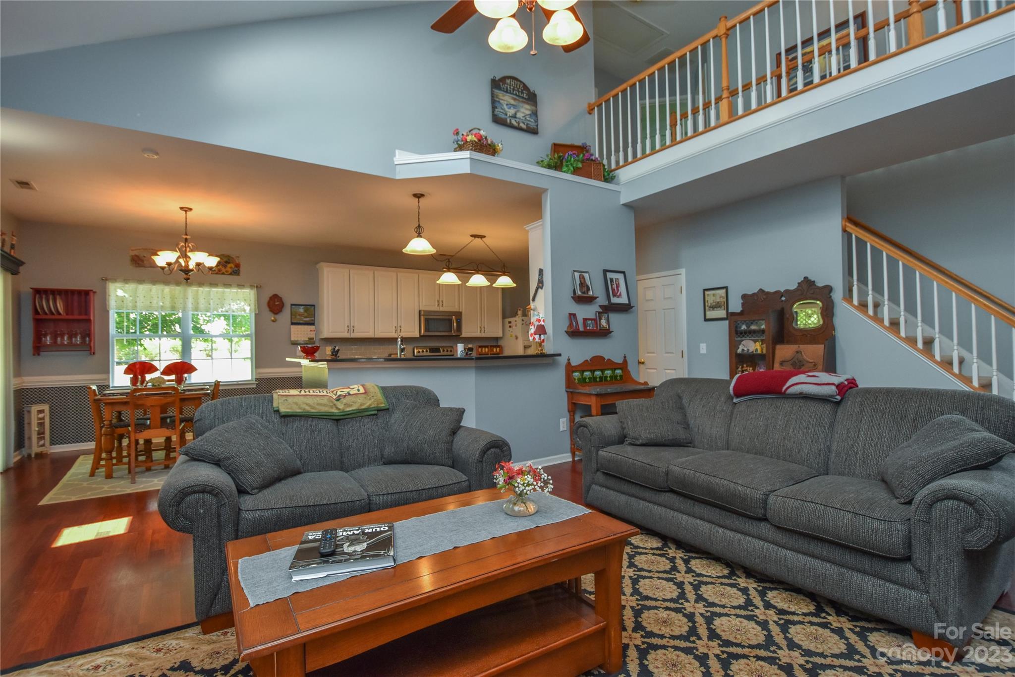 120 Comata Road Mooresville, NC 28117 - Photo 11 of 25 a living room with furniture and a dining table