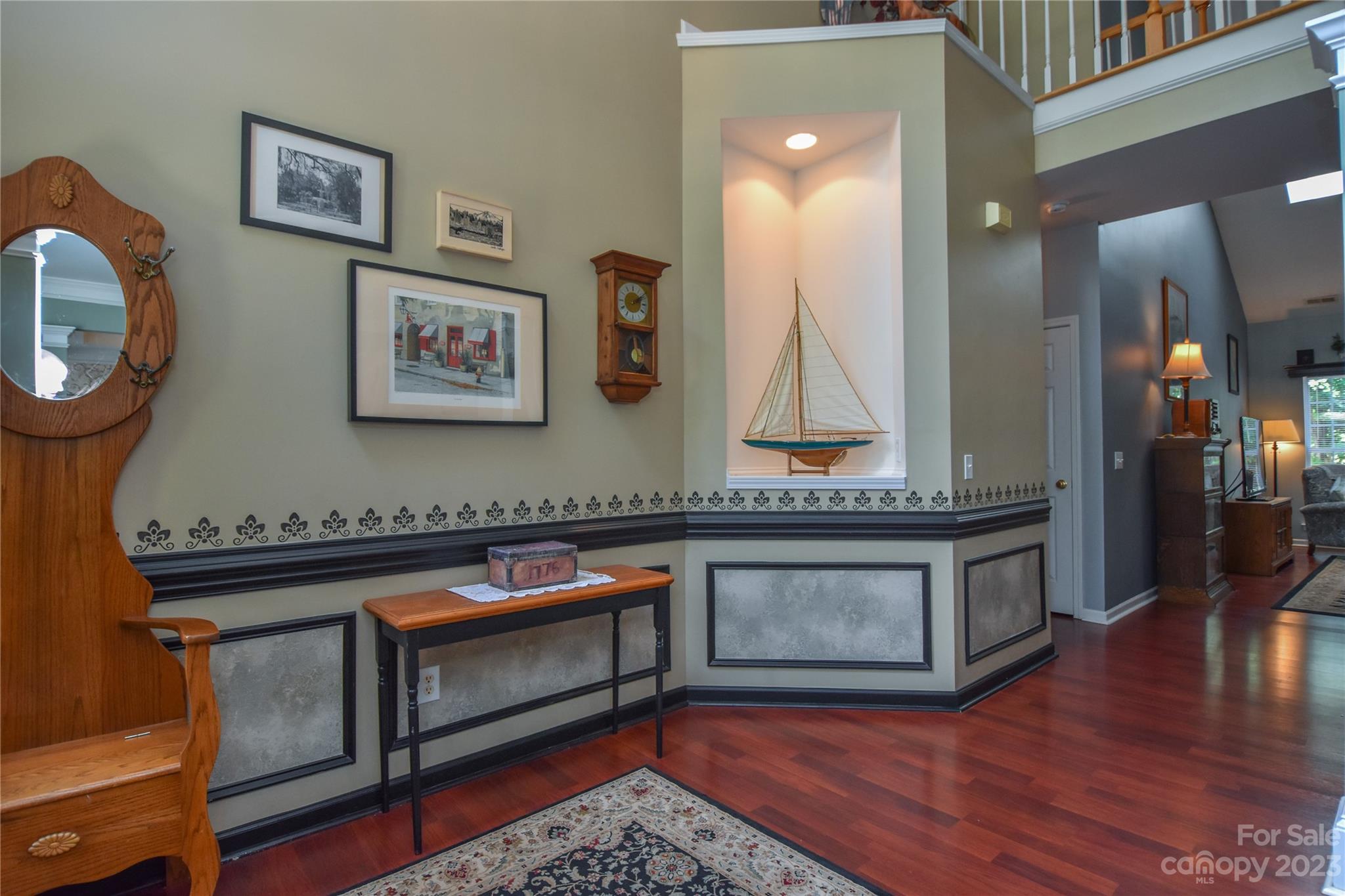 120 Comata Road Mooresville, NC 28117 - Photo 3 of 25 a living room with stainless steel appliances furniture a rug and a wooden floor