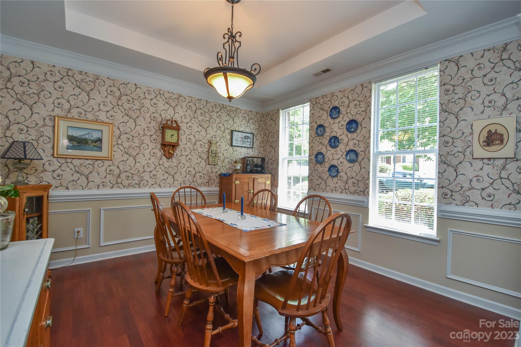 120 Comata Road Mooresville, NC 28117 - Photo 6 of 25 a dining room with furniture a chandelier and wooden floor