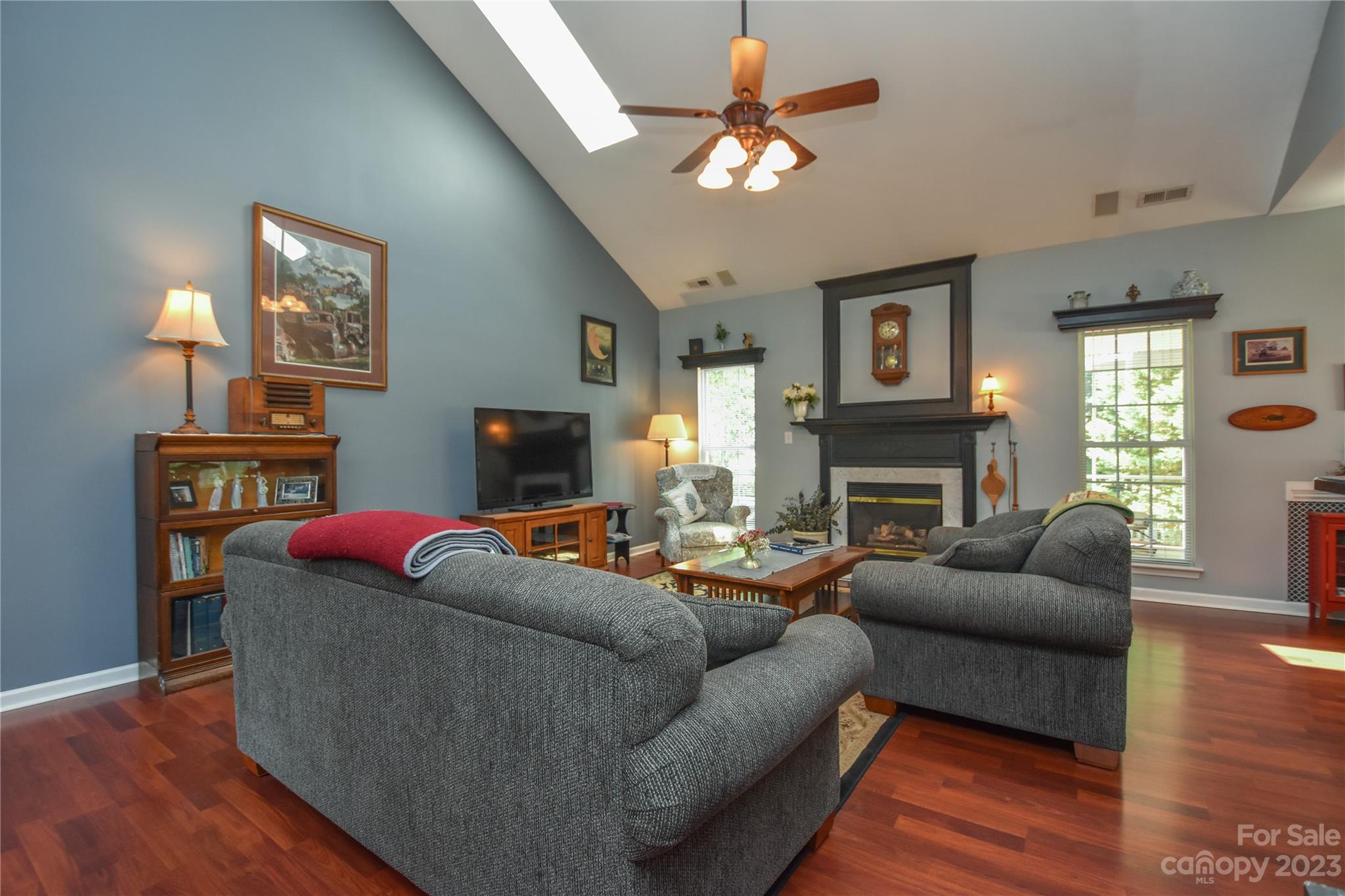 120 Comata Road Mooresville, NC 28117 - Photo 10 of 25 a living room with furniture a flat screen tv and a fireplace