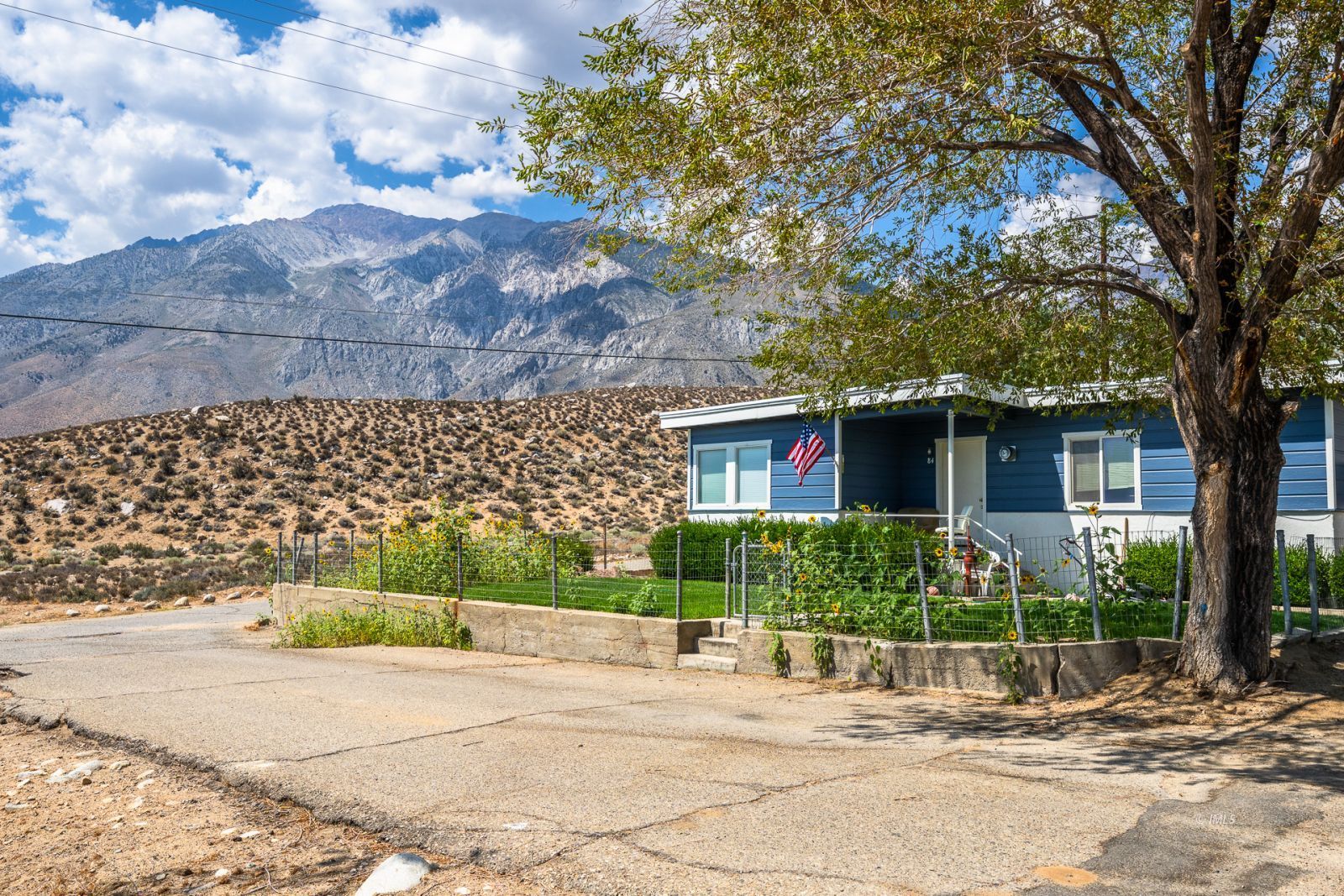 1600 Pine Creek Road Bishop, CA 93514 - Photo 15 of 34 a view of a house with a tree and plants