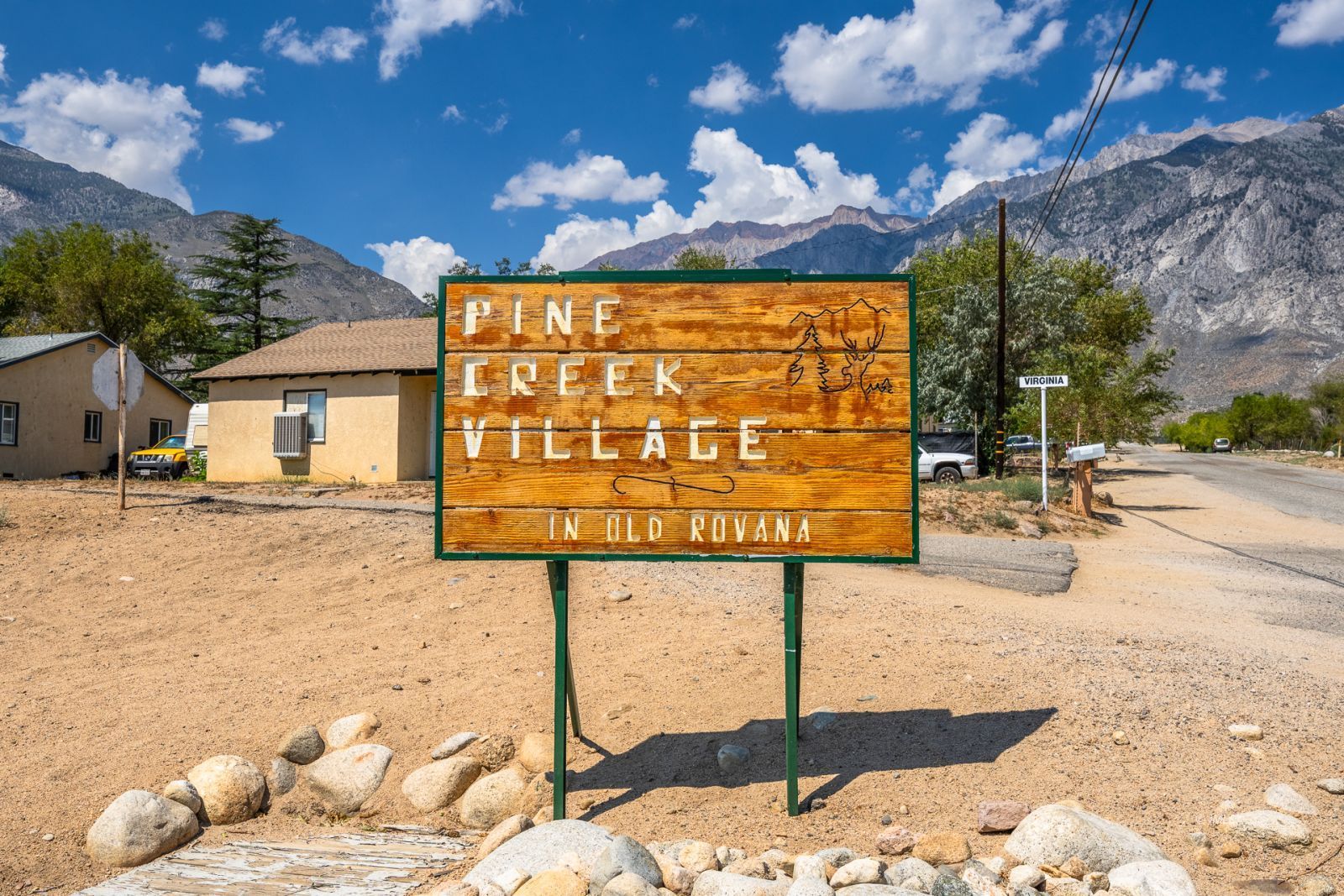 1600 Pine Creek Road Bishop, CA 93514 - Photo 2 of 34 a street sign that is on a brick wall