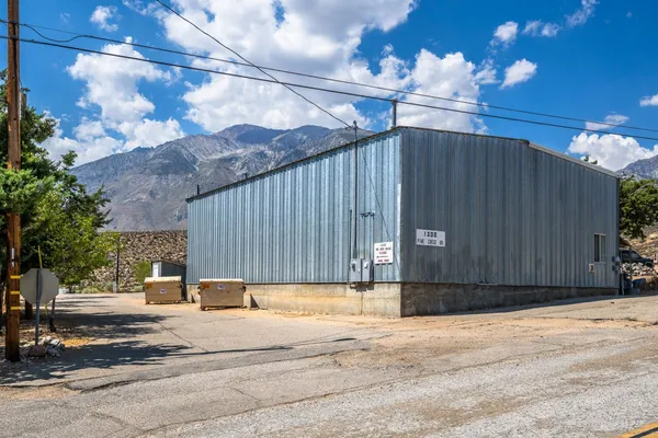 a view of a house with a yard and garage