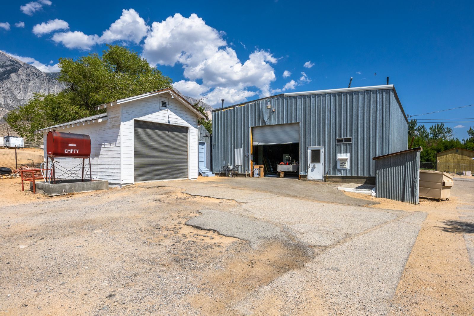 1600 Pine Creek Road Bishop, CA 93514 - Photo 7 of 34 a view of a house with a yard and garage