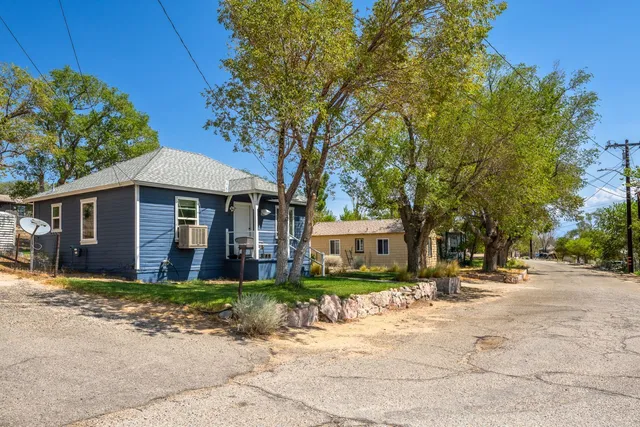 a view of a garden with a building in the background