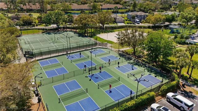an aerial view of a houses with a lake view