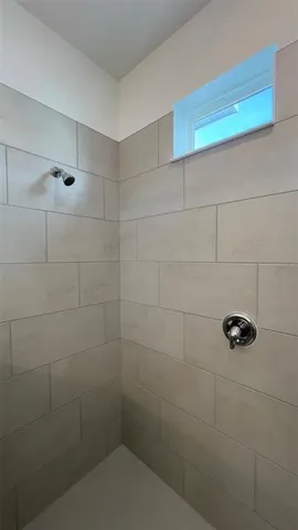 a white toilet sitting next to a white sink