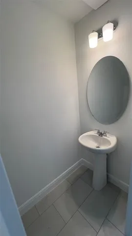 a kitchen with a stove a refrigerator and a sink