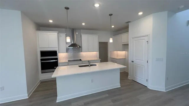 a view of empty room with a ceiling fan and window