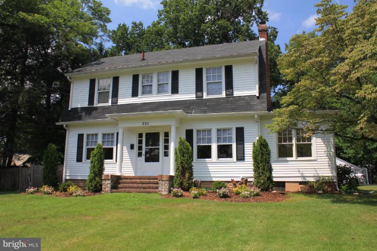 2311 Forest Glen Road Silver Spring, MD 20910 - Photo 1 of 28 front view of a house with a yard