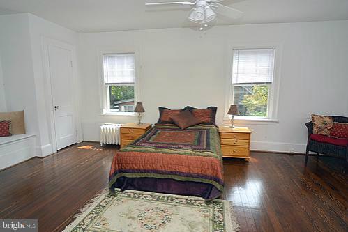 2311 Forest Glen Road Silver Spring, MD 20910 - Photo 15 of 28 a bedroom with a bed and wooden floor