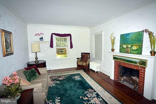 2311 Forest Glen Road Silver Spring, MD 20910 - Photo 21 of 28 a living room with furniture and a fireplace
