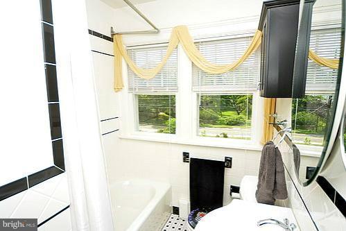 2311 Forest Glen Road Silver Spring, MD 20910 - Photo 8 of 28 a bathroom with a sink and a window