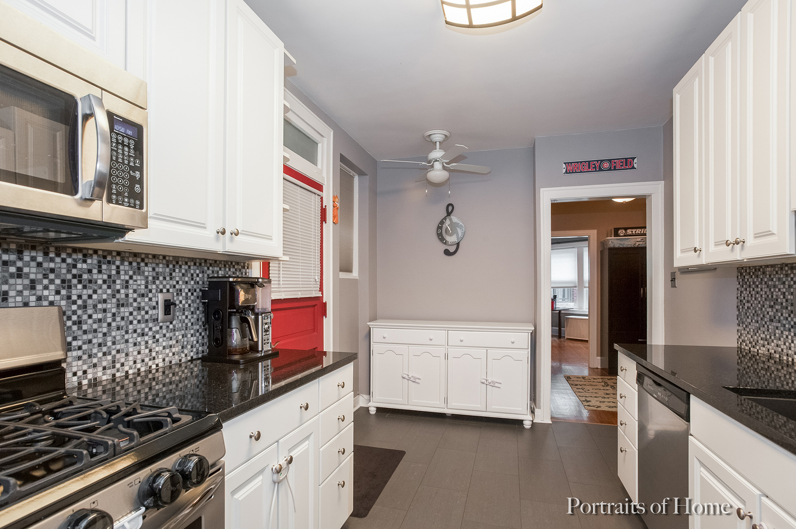 530 Sheridan Road, Unit 2A Evanston, IL 60202 - Photo 6 of 11 a kitchen with stainless steel appliances granite countertop a stove and a sink