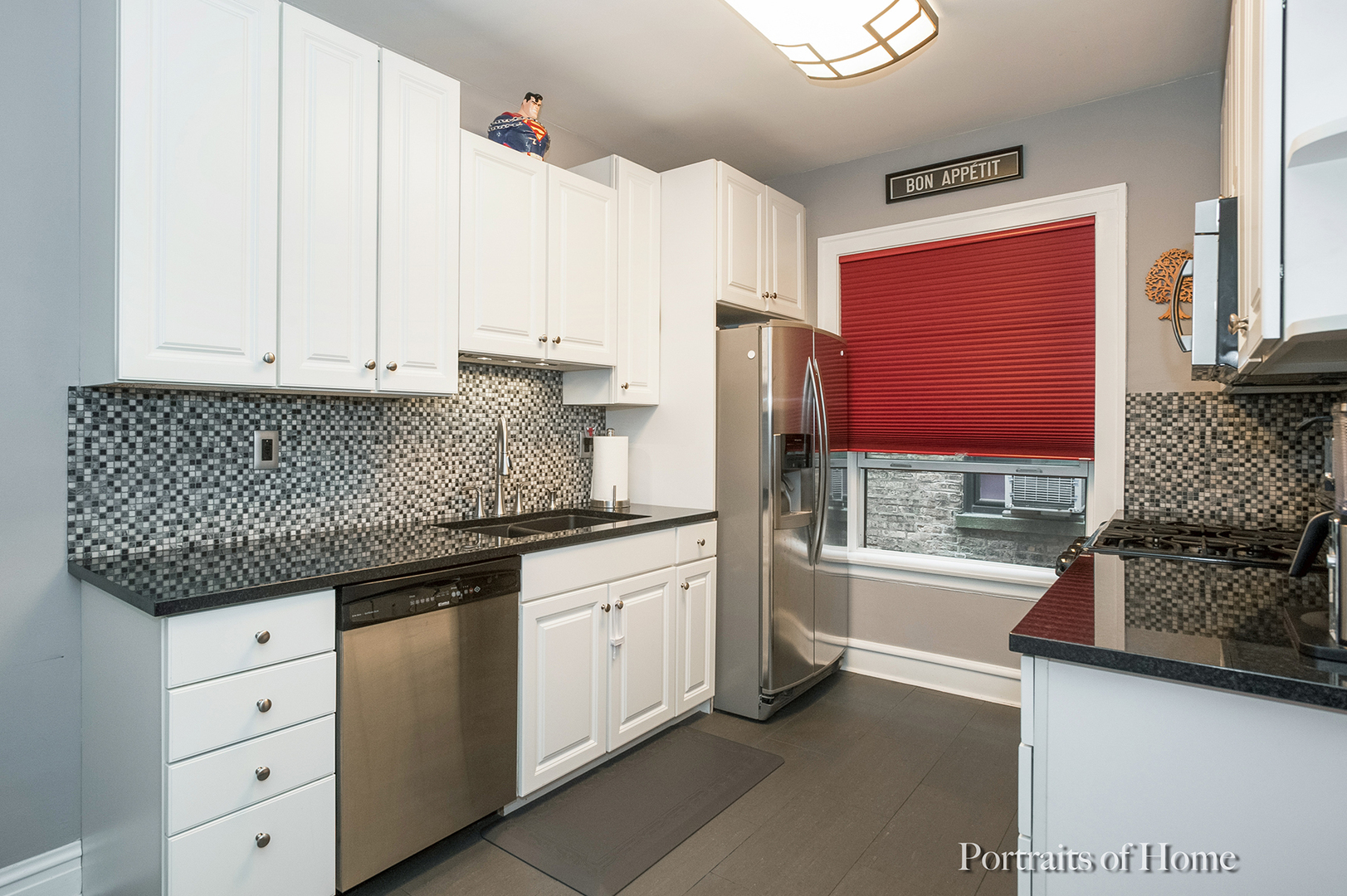 530 Sheridan Road, Unit 2A Evanston, IL 60202 - Photo 7 of 11 a kitchen with granite countertop a sink and a refrigerator