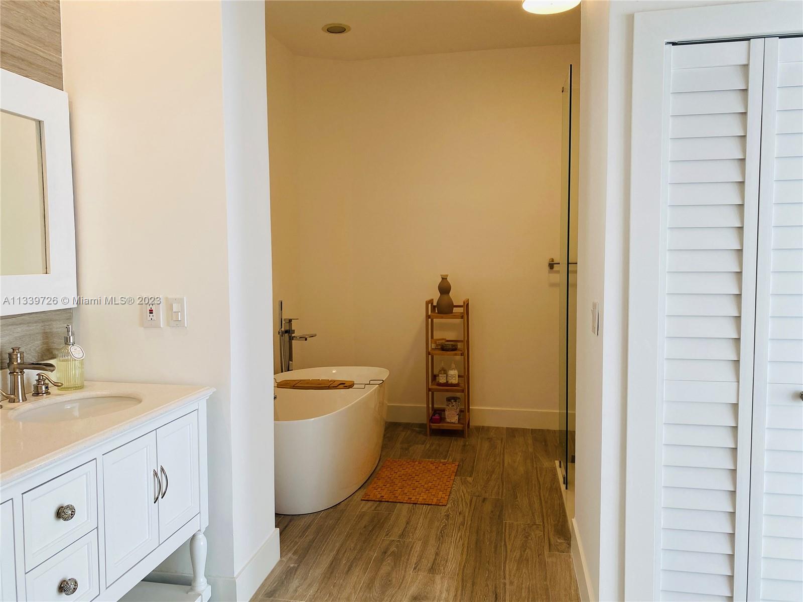 8528 Southwest 121st Street Miami, FL 33156 - Photo 14 of 26 a bathroom with a granite countertop sink toilet and shower