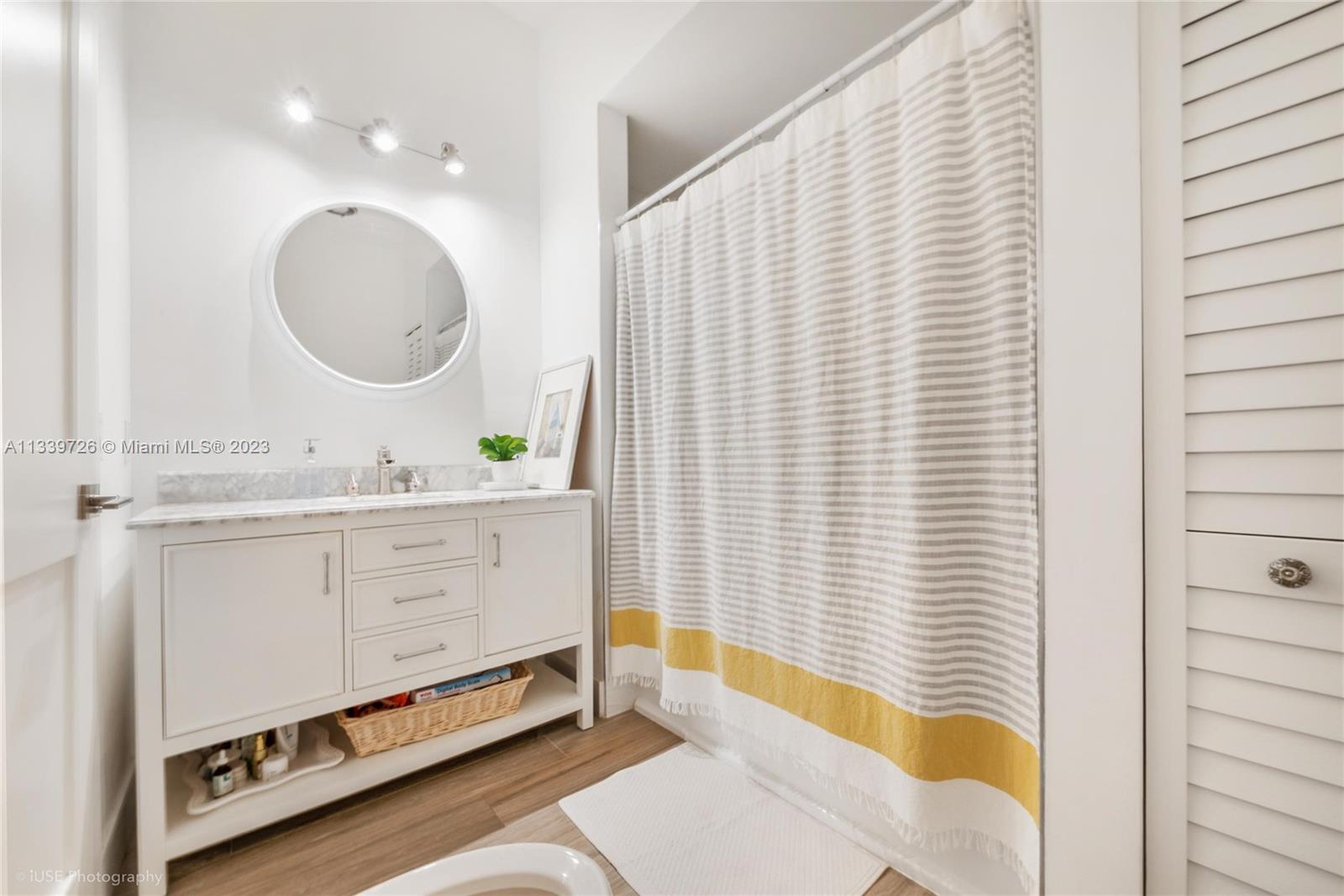 8528 Southwest 121st Street Miami, FL 33156 - Photo 20 of 26 a bathroom with a sink double vanity and a mirror