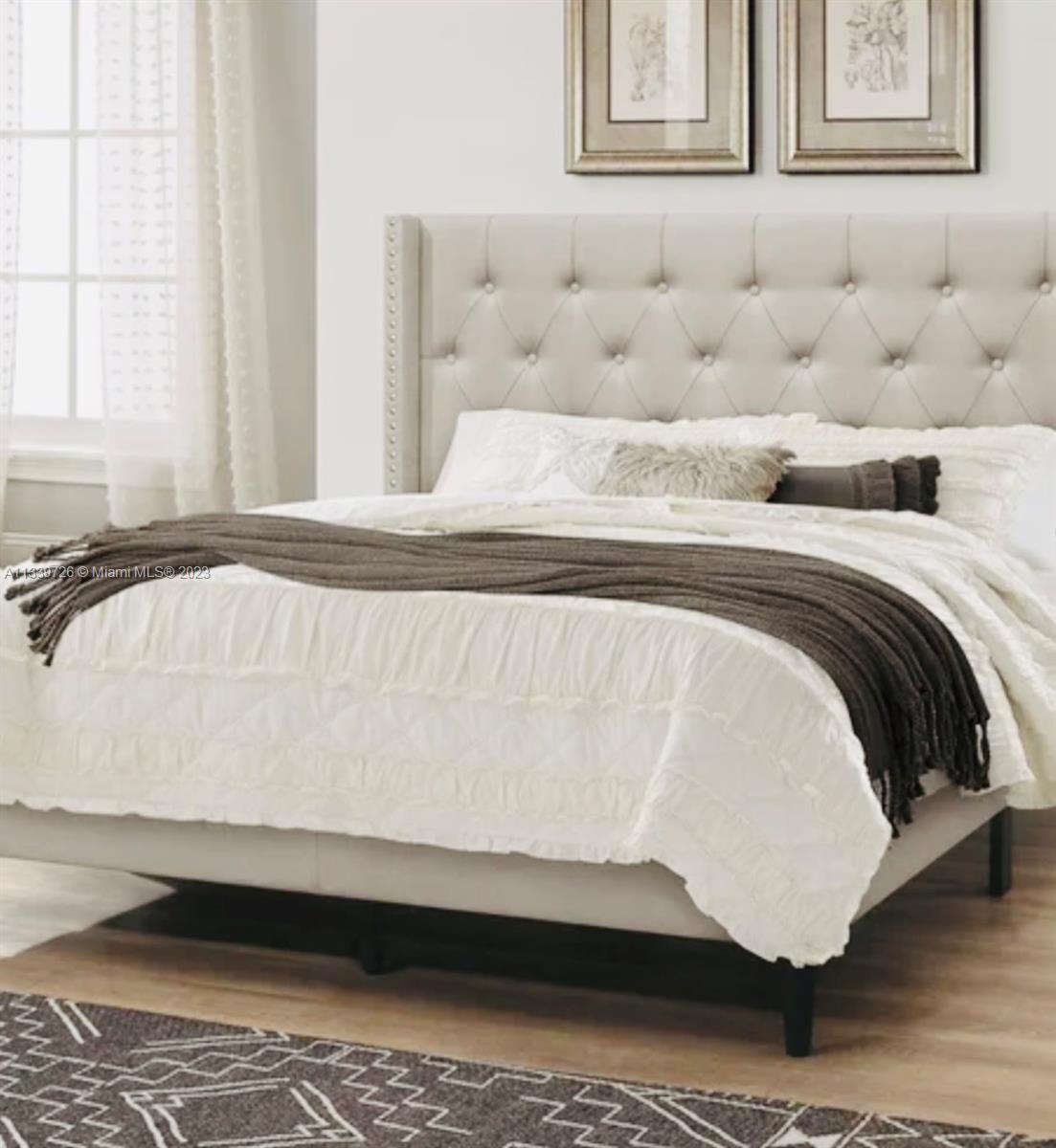 8528 Southwest 121st Street Miami, FL 33156 - Photo 22 of 26 a bed sitting in a bedroom next to a window