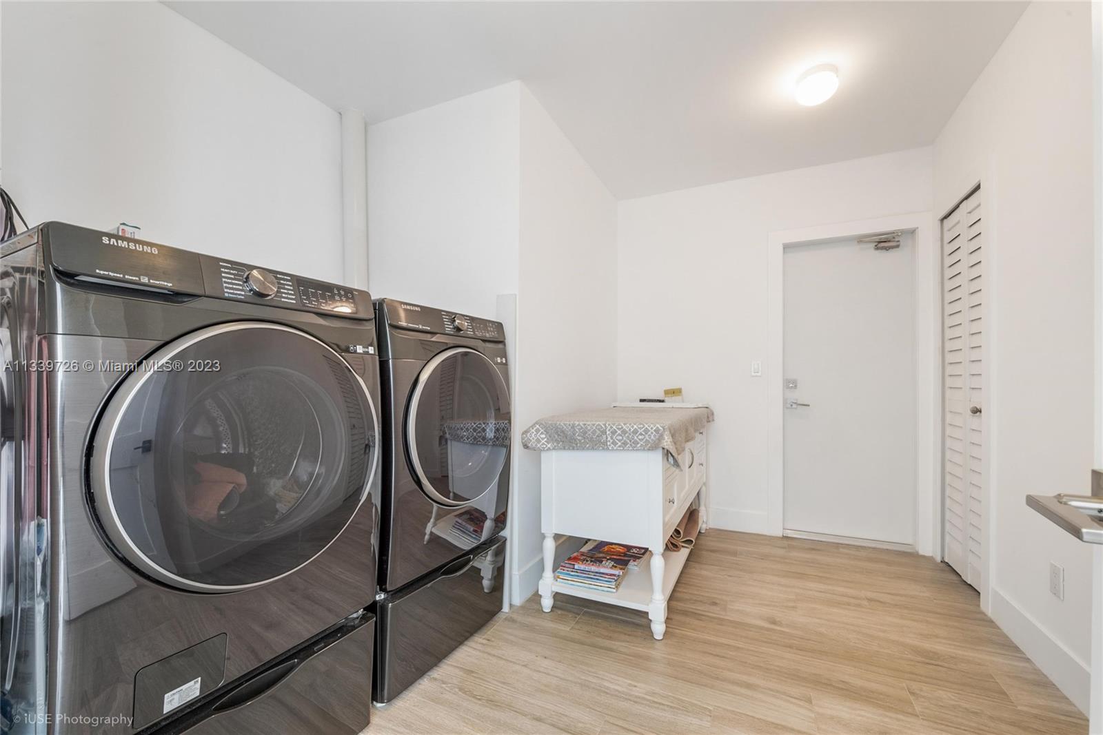 8528 Southwest 121st Street Miami, FL 33156 - Photo 23 of 26 a utility room with sink dryer and washer