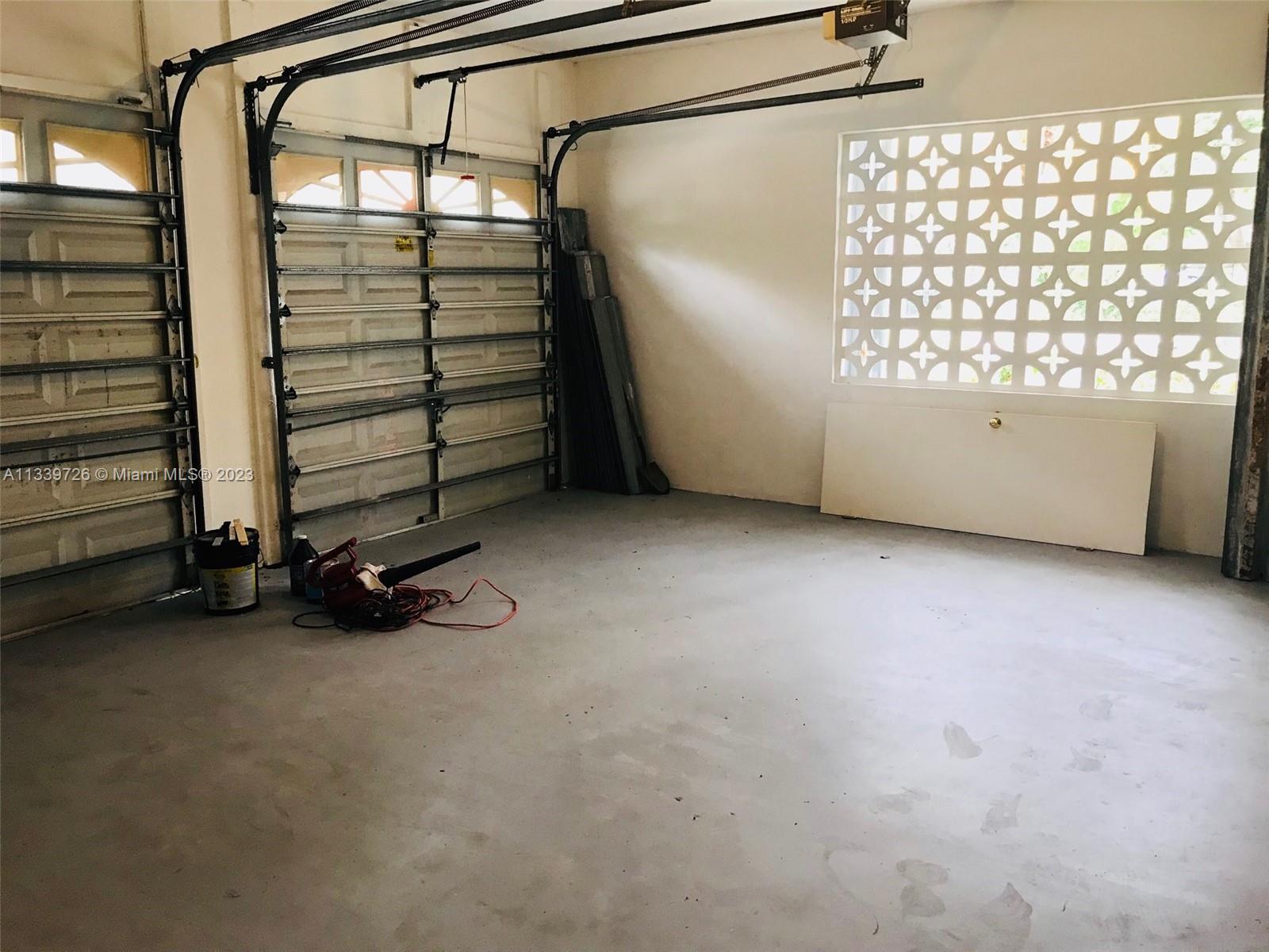 8528 Southwest 121st Street Miami, FL 33156 - Photo 25 of 26 a view of a room with racks on the wall