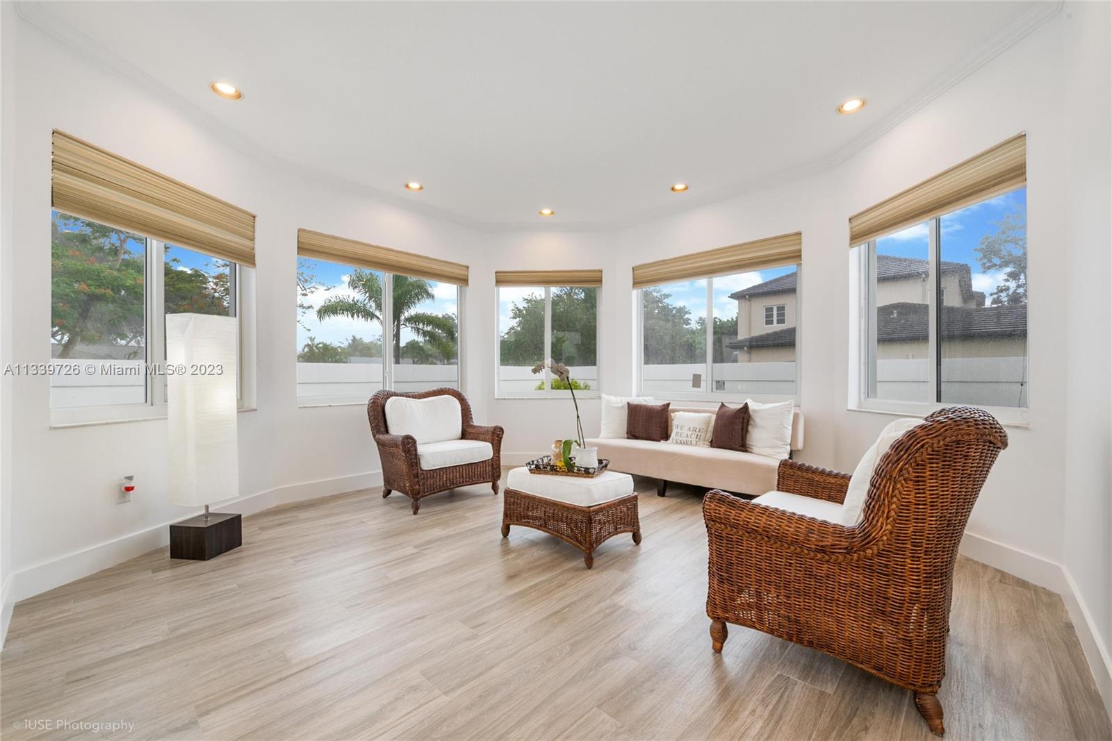 8528 Southwest 121st Street Miami, FL 33156 - Photo 5 of 26 a living room with furniture and a large window