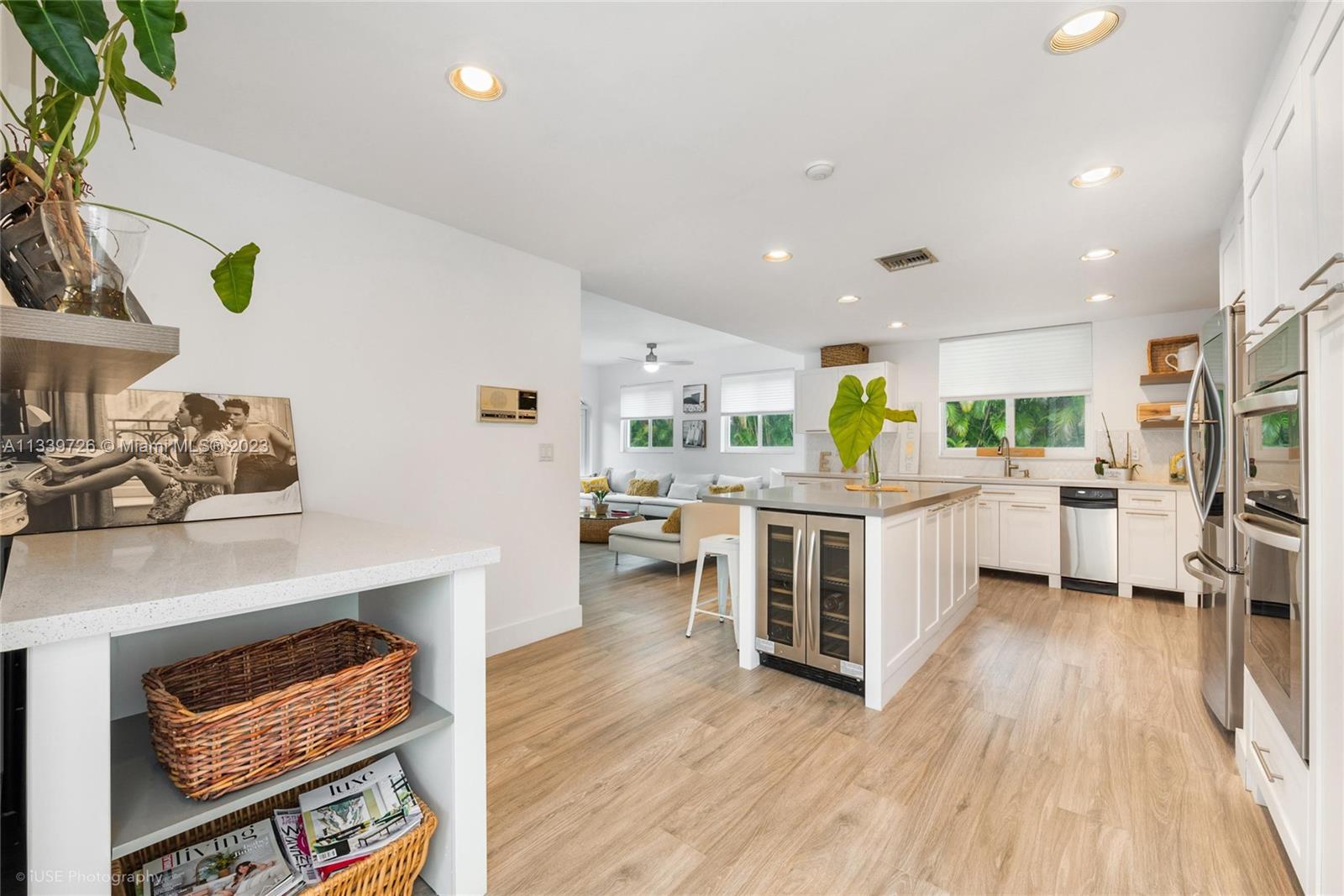 8528 Southwest 121st Street Miami, FL 33156 - Photo 9 of 26 a large white kitchen with lots of counter space and stainless steel appliances