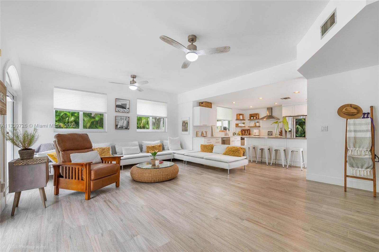 8528 Southwest 121st Street Miami, FL 33156 - Photo 10 of 26 a living room with furniture and a wooden floor
