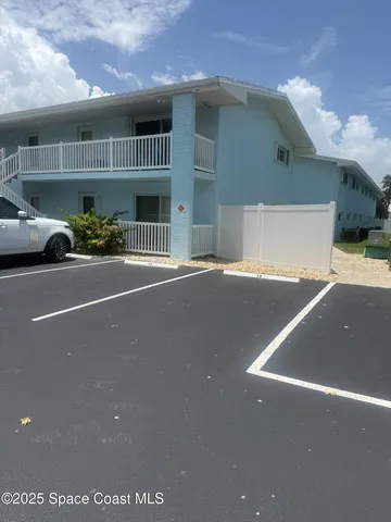a view of a street with cars