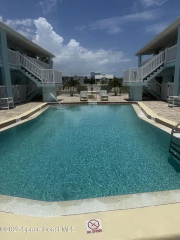 a swimming pool is sitting in the grass