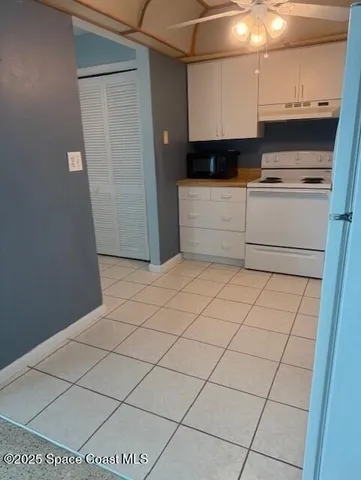 a kitchen with stainless steel appliances a sink and a refrigerator