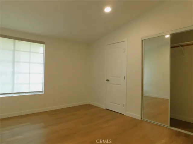an empty room with a empty space and windows