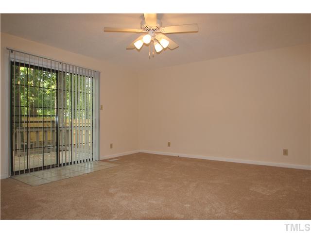 817 Wyldewood Road Durham, NC 27704 - Photo 5 of 14 a view of an empty room with a window