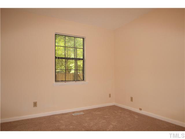 817 Wyldewood Road Durham, NC 27704 - Photo 10 of 14 an empty room with windows