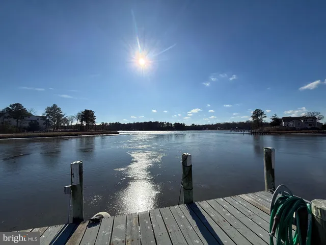 a view of a lake with wooden floor and lake view