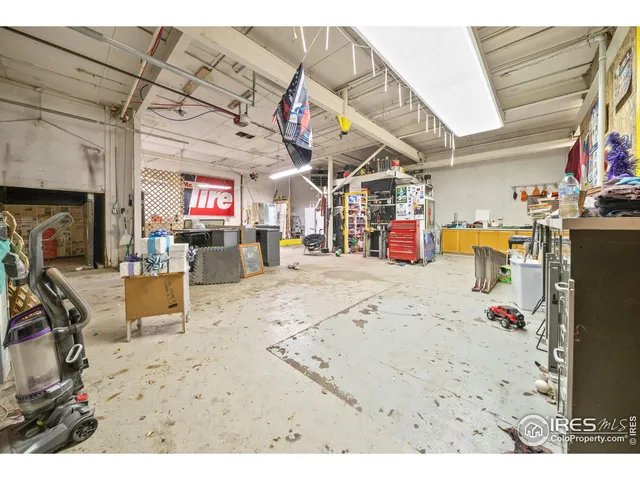 a kitchen with a refrigerator and a sink