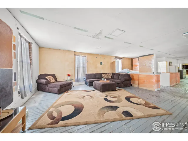 a view of a livingroom with furniture and wooden floor