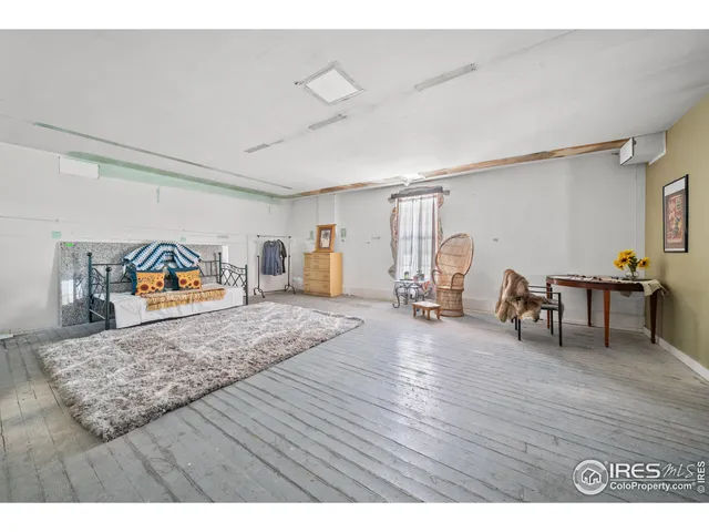 a view of a living room and bedroom